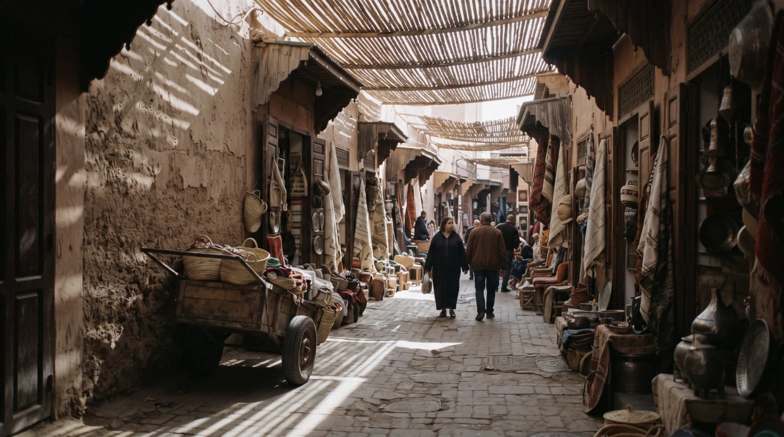 Reed roofing throwing bars of light across Souk Semmarine in the morning, one of the free things to do in Marrakech