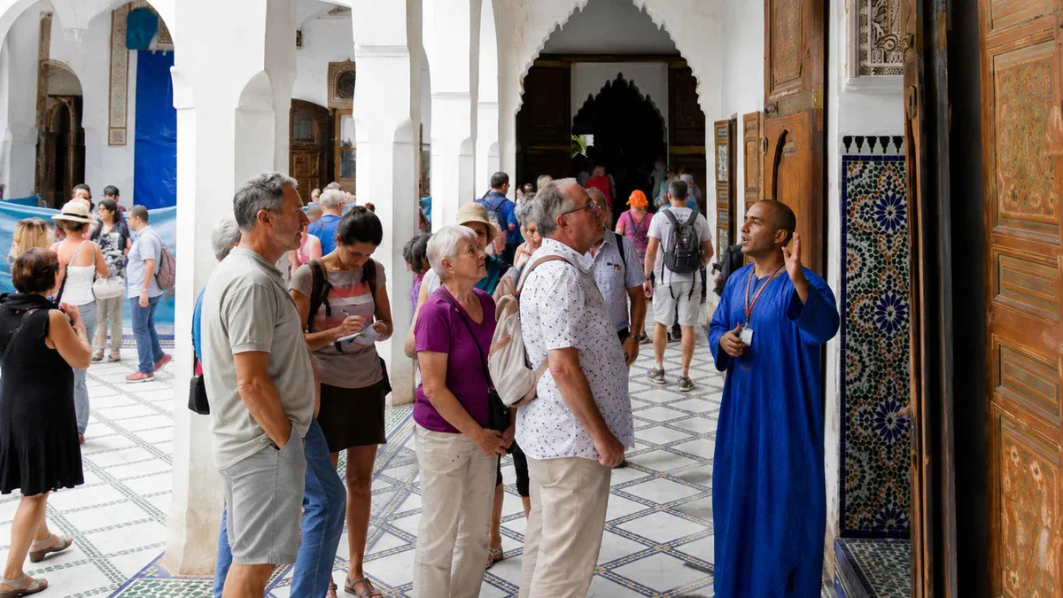 Zellige tilework and carved cedar ceiling in a courtyard of Bahia Palace on a Bahia Palace guided tour in Marrakech