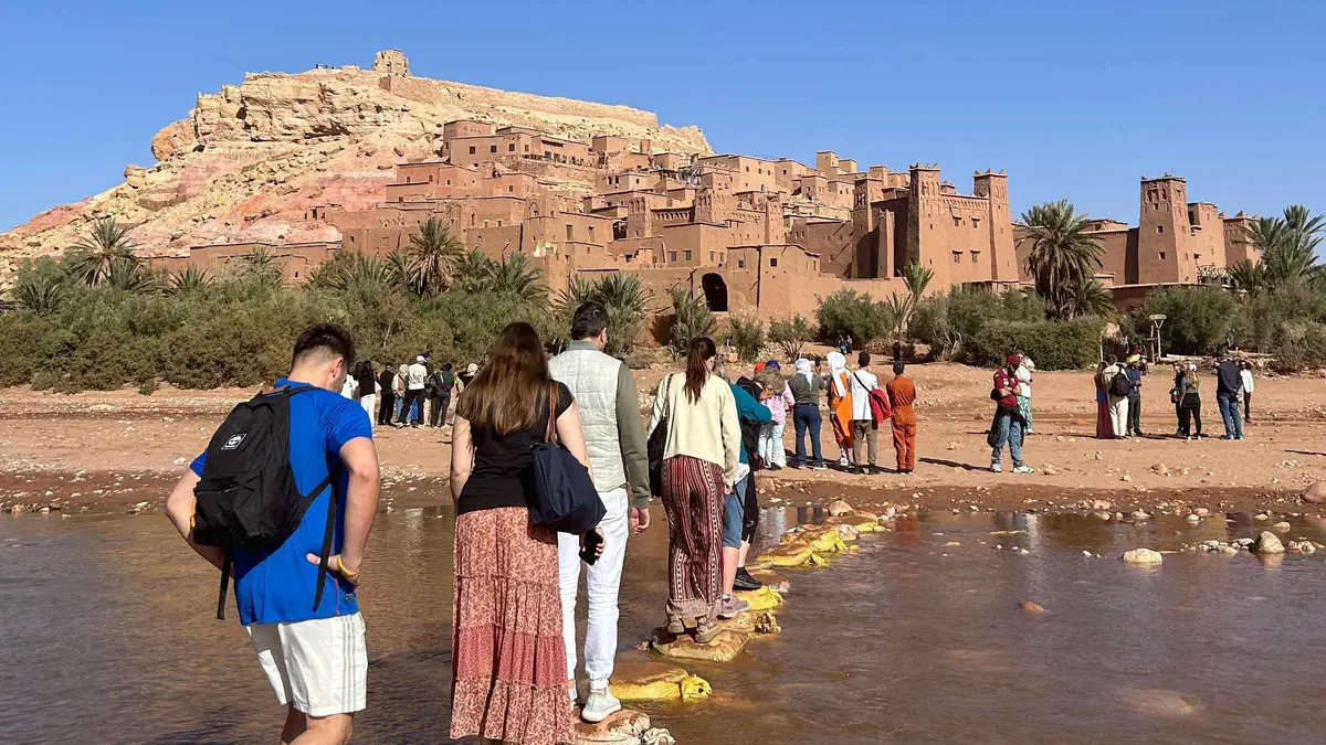 Visitors climbing the ksar lanes at Ait Ben Haddou on an Ait Ben Haddou and Ouarzazate guided day trip from Marrakech
