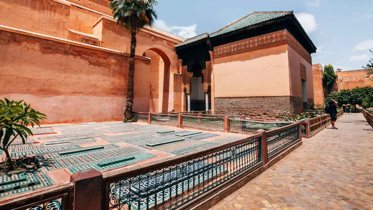 Marble columns and gilded honeycomb ceiling above the Saadian Tombs graves on a Saadian Tombs entry ticket visit in Marrakech